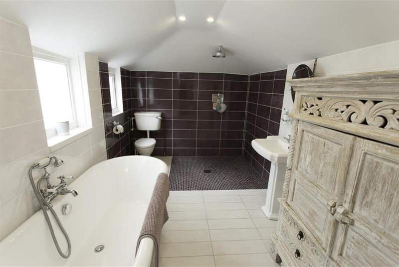 Family bathroom with open wet-room shower.