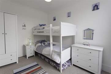 The bunk bedroom is a delightful room for children.