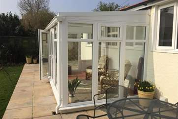 Conservatory with access to patio and garden.