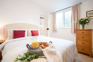 The bright and spacious main bedroom.
