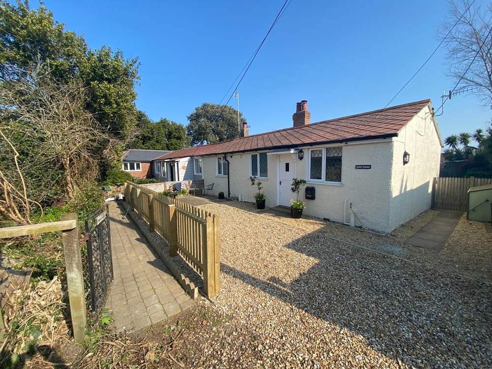 Quiet Corner offers parking for two cars.
