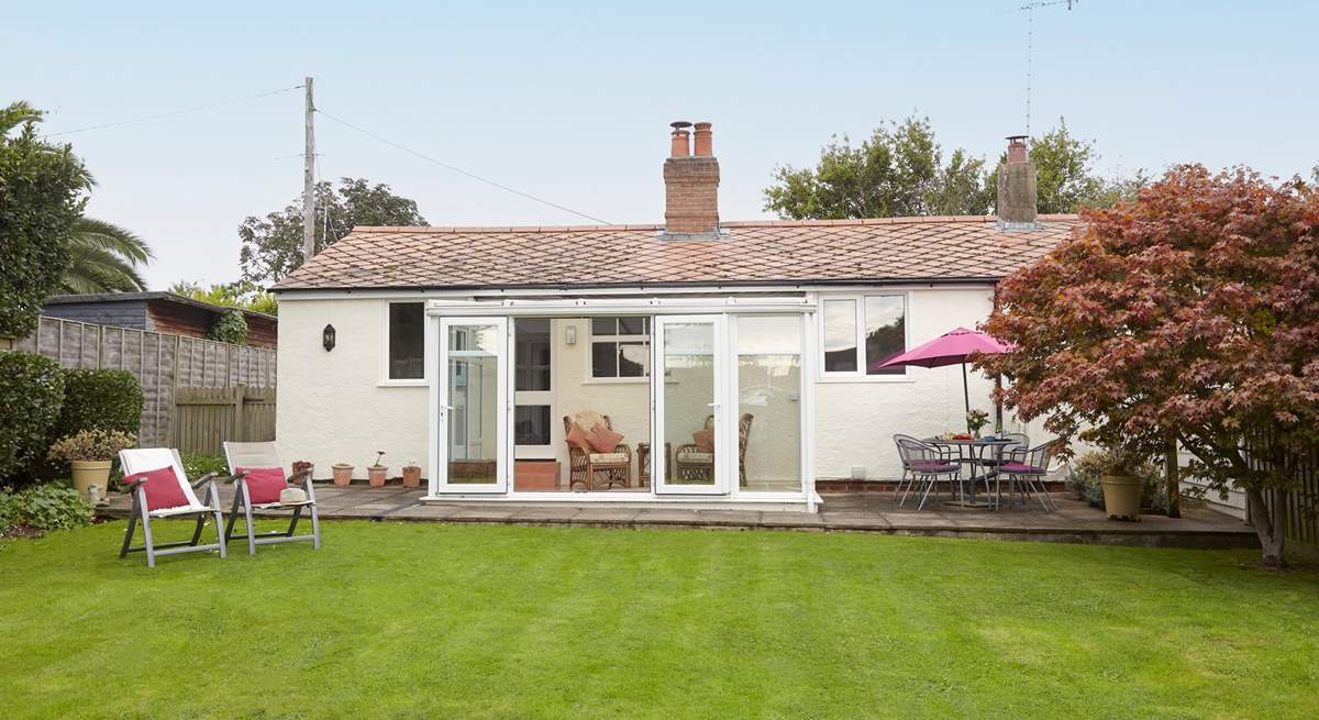 The spacious and enclosed garden is ideal for the family dog.