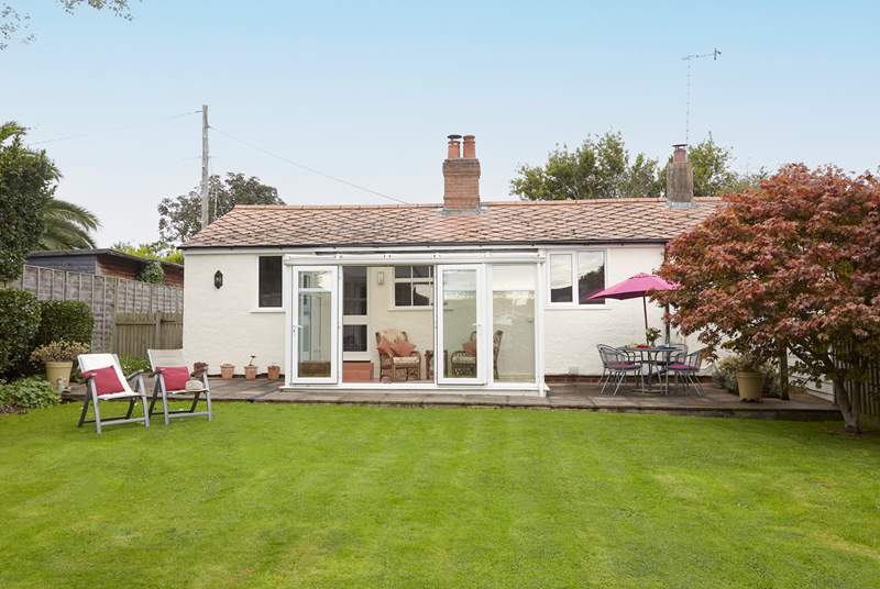 The spacious and enclosed garden is ideal for the family dog.