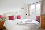 Bright and spacious, the main bedroom with ensuite shower room.