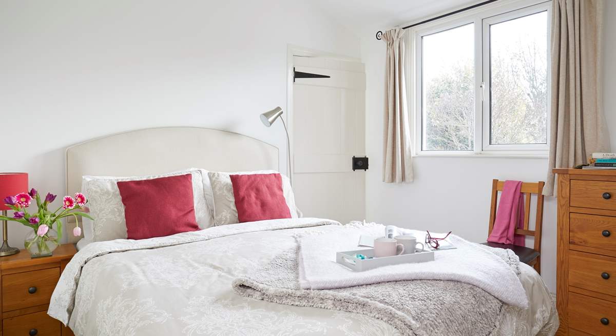 The main bedroom is light and airy with an ensuite shower room.