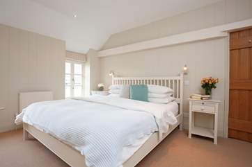 A second double bedroom with a convenient cloakroom.