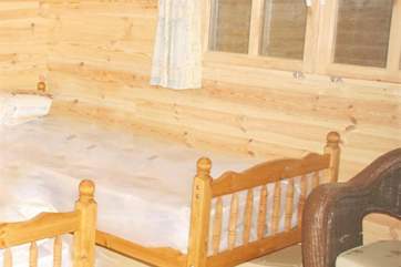 The twin beds in the chalet offer flexibility for sleeping in the warmer months between 30th April and 30th September.
