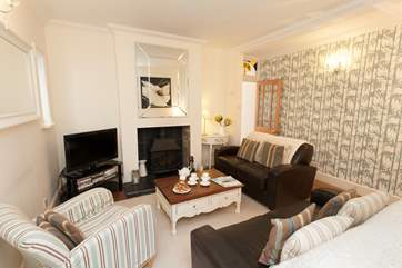The second sitting room offers ample space for the whole family to gather and enjoy a night in.