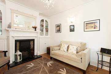 At the front of the house is a bright, inviting living room, an ideal space for quiet time.
