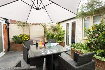 The enclosed patio is the perfect spot for al fresco dining but equally convenient for young children at play.