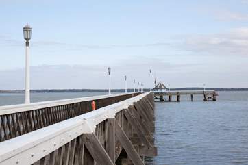 Stroll along the pier and simply watch the boats sail by.