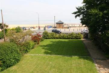Children can let off steam in this lovely, two level, lawned garden.