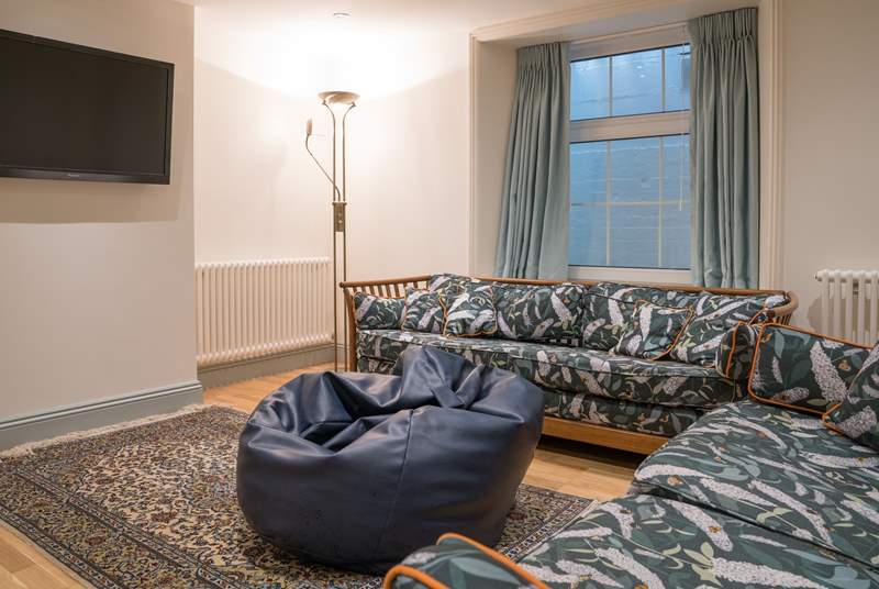 Spend an evening in watching a film with the family in this comfortable snug. 