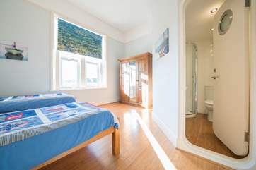 The fifth bedroom on the first floor with twin beds and en suite shower-room.