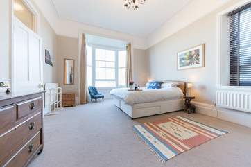 The spacious second bedroom with super-king bed on the first floor, provides stunning views towards Ryde beach.