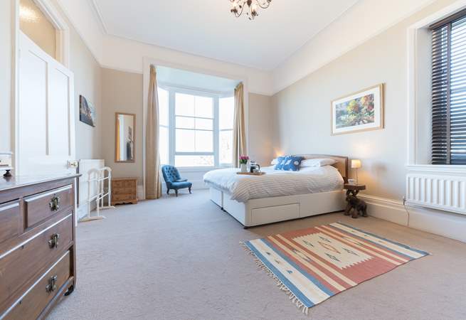 The spacious second bedroom with super-king bed on the first floor, provides stunning views towards Ryde beach. 