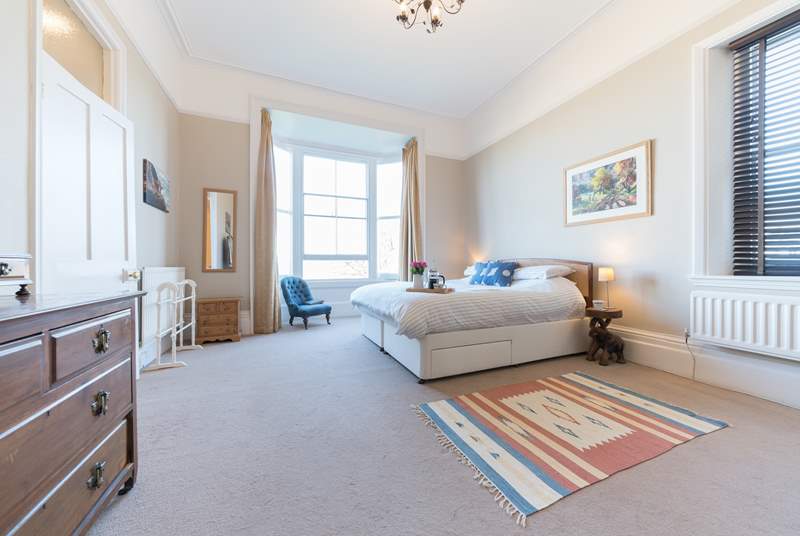 The spacious second bedroom with super-king bed on the first floor, provides stunning views towards Ryde beach. 