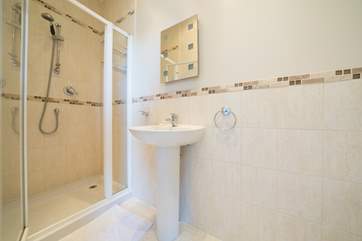 This en suite shower-room leads off the second bedroom.