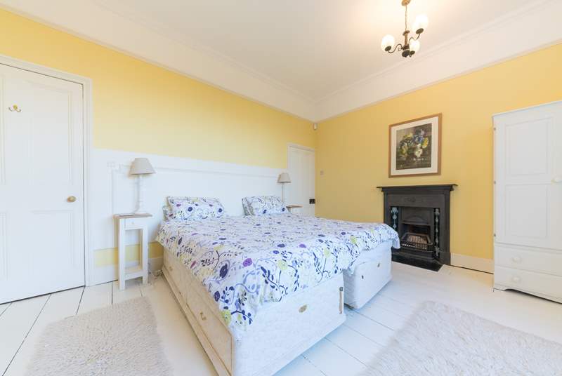 The light and airy first bedroom with twin beds on the ground floor.