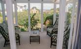 Lovely light and sunny conservatory with garden and sea views. - Thumbnail Image