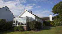 Sunny fully-enclosed garden at the front of the property.