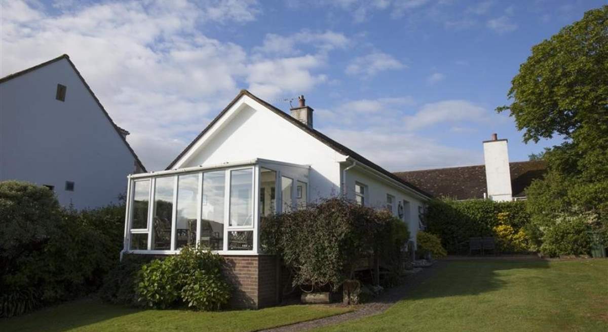 Sunny fully-enclosed garden at the front of the property.