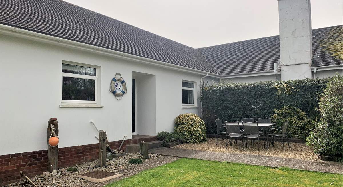 Take advantage of the island sunshine in the outside dining-area with enclosed garden.