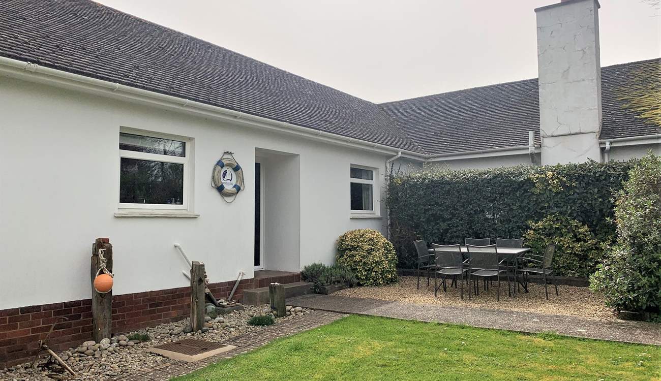 Take advantage of the island sunshine in the outside dining-area with enclosed garden.