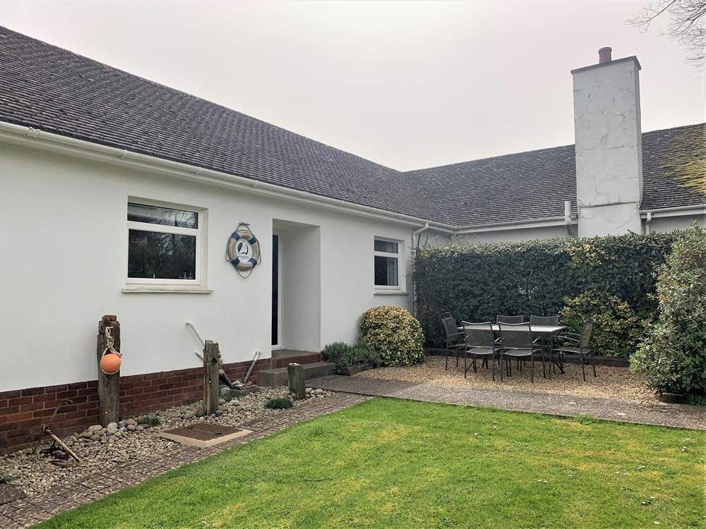 Take advantage of the island sunshine in the outside dining-area with enclosed garden.