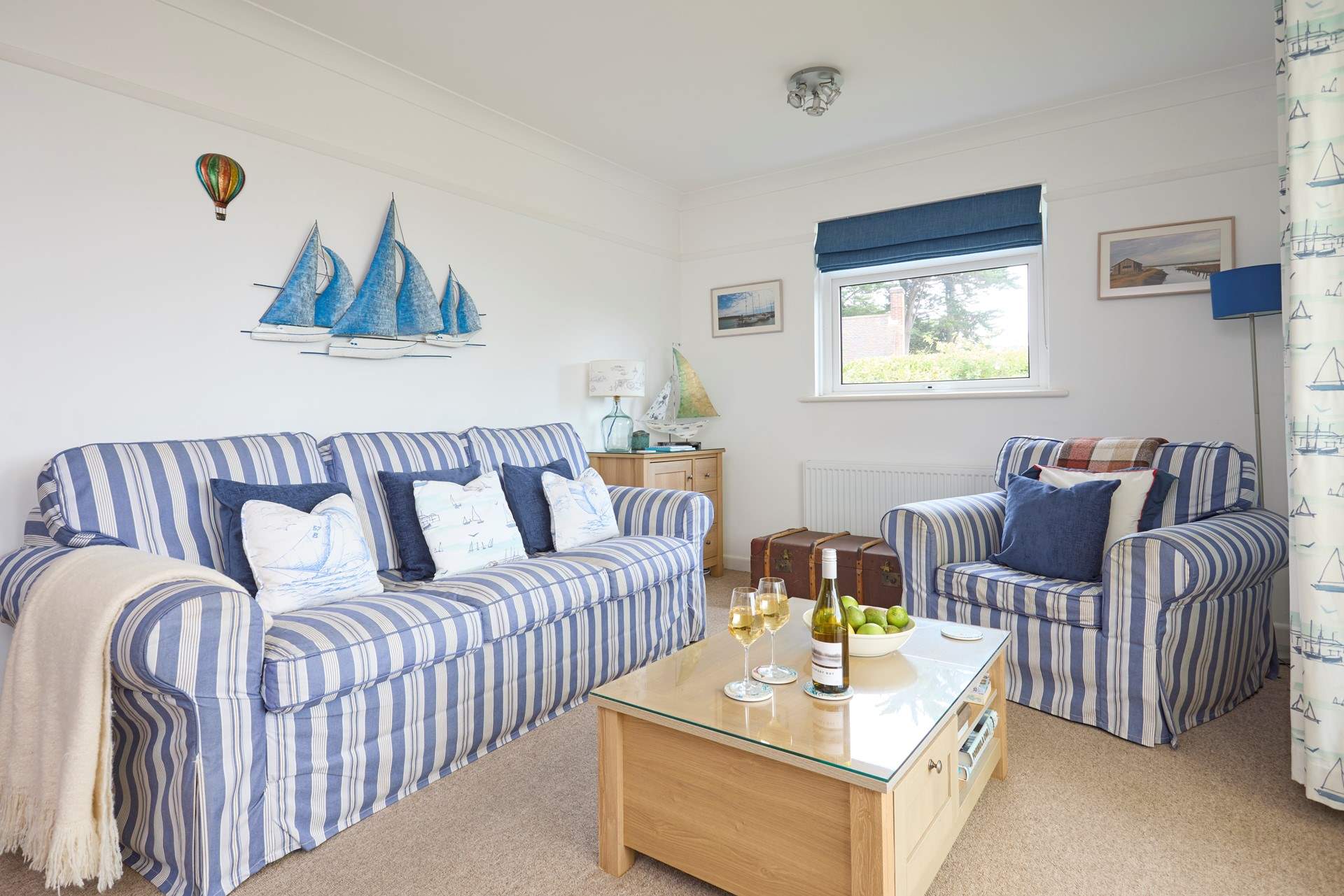 The open plan sitting/dining area leads to the conservatory and garden beyond.