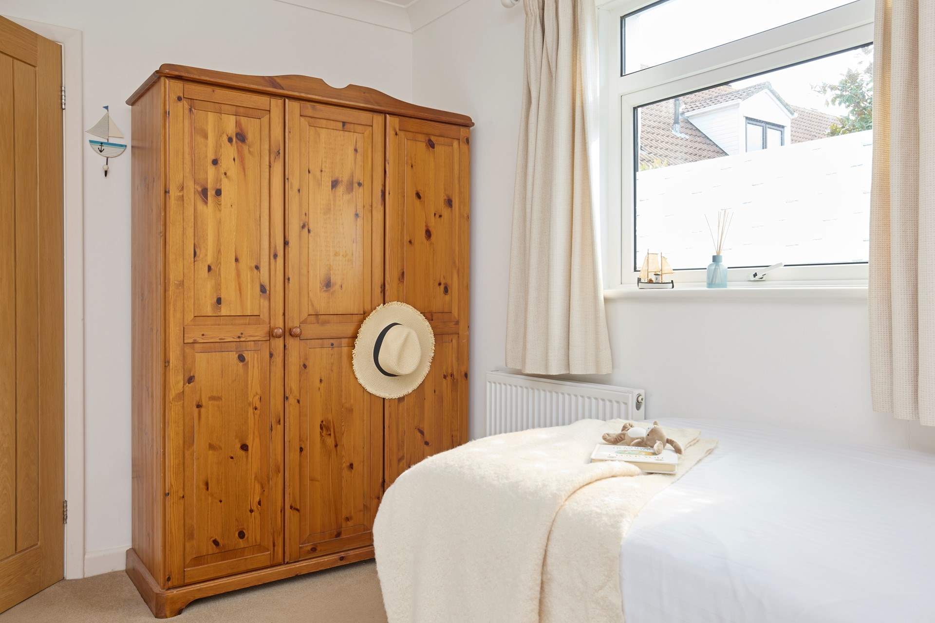 Another bright and airy bedroom with plenty of storage.