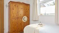 Another bright and airy bedroom with plenty of storage.