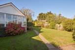 Sunny fully-enclosed garden at the front of the property.