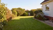 The enclosed garden is well maintained, perfect for the little ones and your four-legged friend.