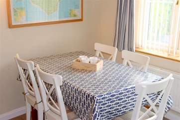 The fresh and inviting dining-area is in the main sitting-room.