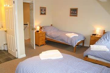 Bedroom 2 is spacious with three single beds.