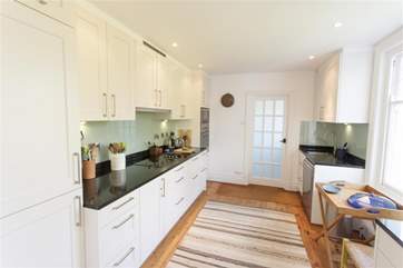 Lovely modern kitchen with attached utility-room