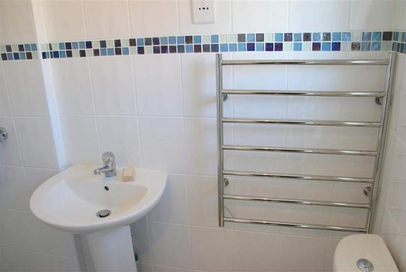 The shower-room features a modern walk-in shower.