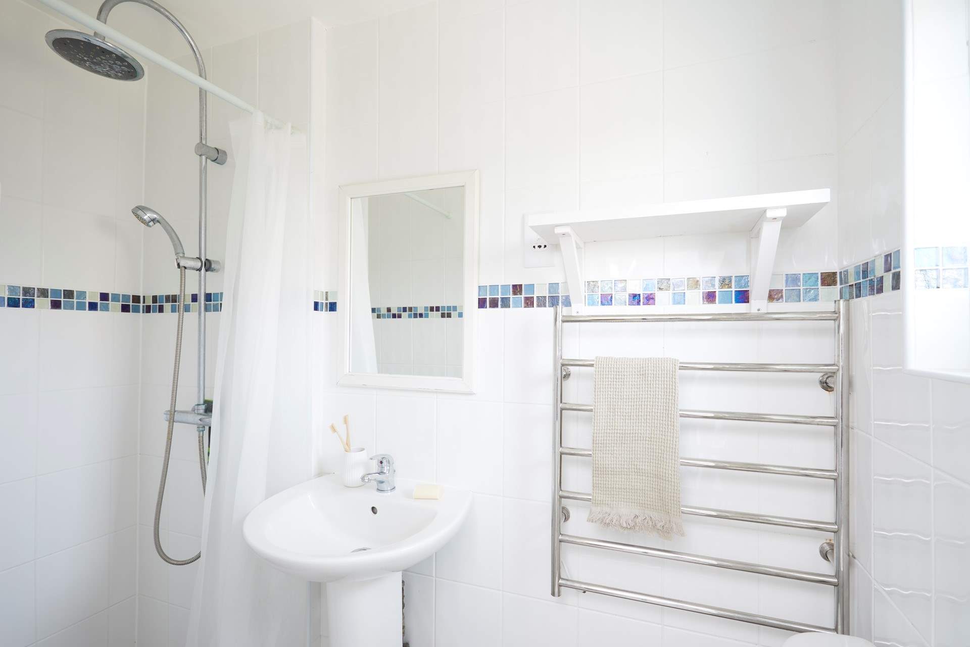 The shower room is perfect for a refreshing shower after a busy beach day. 