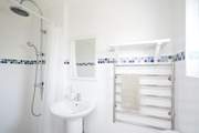 The shower room is perfect for a refreshing shower after a busy beach day.
