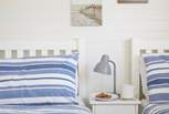The twin bedroom is decorated in seaside colours. 