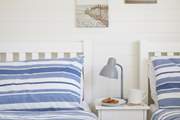 The twin bedroom is decorated in seaside colours.