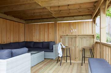 The summer house is the perfect place to gather round and enjoy some quality time together.