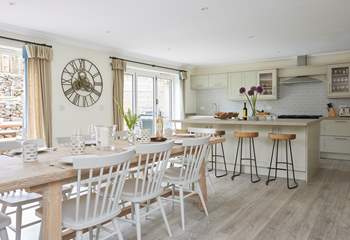The modern style open plan kitchen and dining room. 