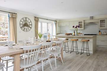 The modern style open plan kitchen and dining room.