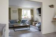 The open plan style links to the comfortable living-room.