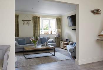 The open plan style links to the comfortable living-room.