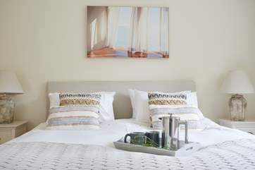 The sleek main bedroom ...