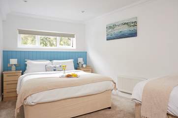 The mezzanine bedroom with king-size double bed and a single bed.