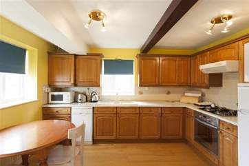 Large well equipped kitchen with dining area